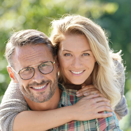 Happy middle-aged couple outdoors