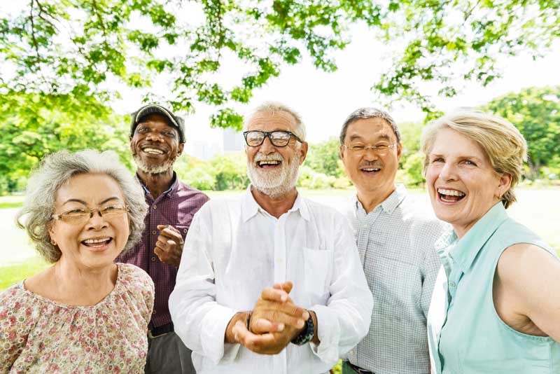 Group of happy elderly people outdoors