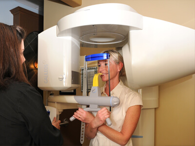 Female patient getting cone beam scans